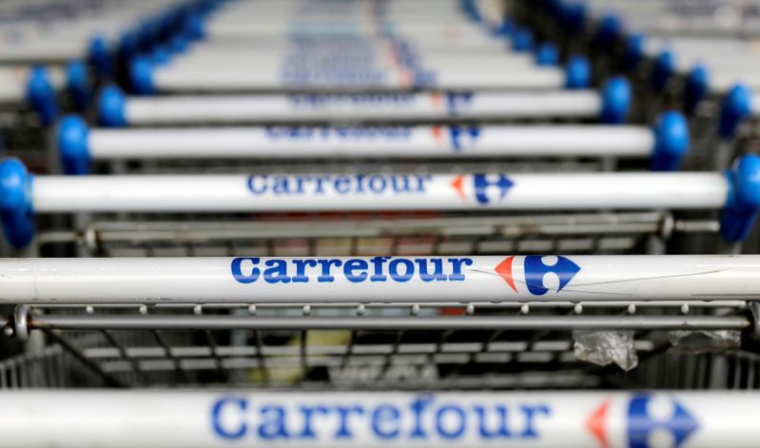 CARREFOUR A REJETÉ UNE OFFRE DE PRISE DE CONTRÔLE PAR AUCHAN, RAPPORTE LES ECHOS