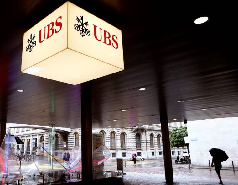The logo of Swiss bank UBS is seen at the entrance of an office building in Zurich