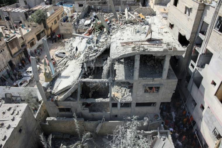Bâtiment détruit par un bombardement israélien le 21 mai 2024 dans le quartier d'Al-Daraj, dans la ville de Gaza, sur fonds de combats entre Israël et le mouvement islamiste palestinien Hamas ( AFP / - )