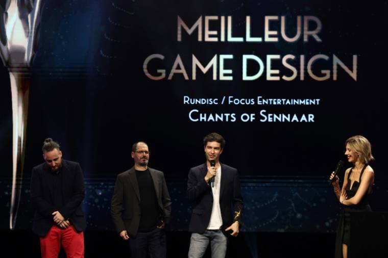The Rundisc and Focus Entertainment team receives the Pegasus for Best Game Design Award for 'Chants Of Sennaar' at La Cigale in Paris on March 7, 2024 (AFP / EMMANUEL DUNAND)