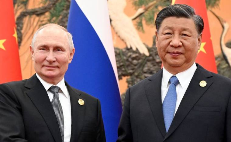 Le président russe Vladimir Poutine et le président chinois Xi Jinping lors d'une réunion à Pékin