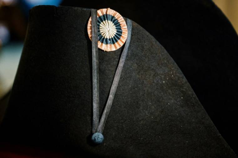 A bicorne of Napoleon I, with his blue, white and red cockade exhibited at the Osenat auction house, on November 6, 2023 in Paris, before its auction (AFP / Dimitar DILKOFF)