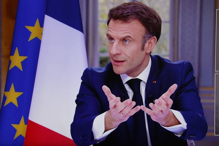 Emmanuel Macron à Paris, le 22 mars 2023. ( AFP / LUDOVIC MARIN )