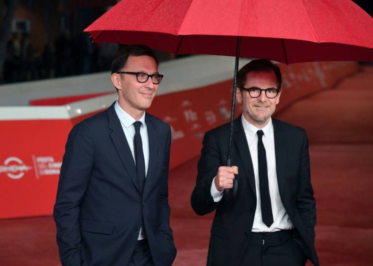 Les scénaristes et réalisateurs français Matthieu Delaporte (d) et Alexandre de La Patelliere arrivent à l'Auditorium Parco della Musica lors du 14e Festival du film de Rome, à Rome, le 23 octobre 2019 ( AFP / Tiziana FABI )