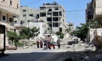 Des Palestiniens fuient la ville de Gaza bombardée après un ordre d'évacuation de l'armée israélienne, le 7 juillet 2024 ( AFP / Omar AL-QATTAA )
