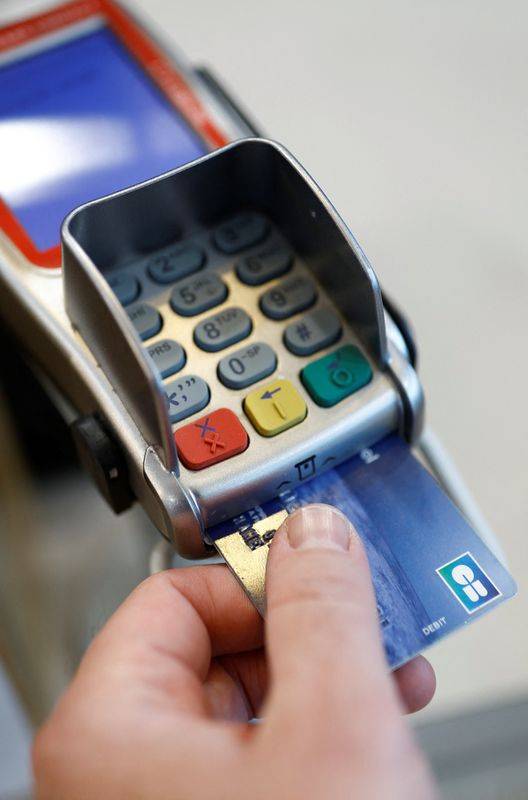 Illustration d'une carte de crédit sur un terminal de paiement
