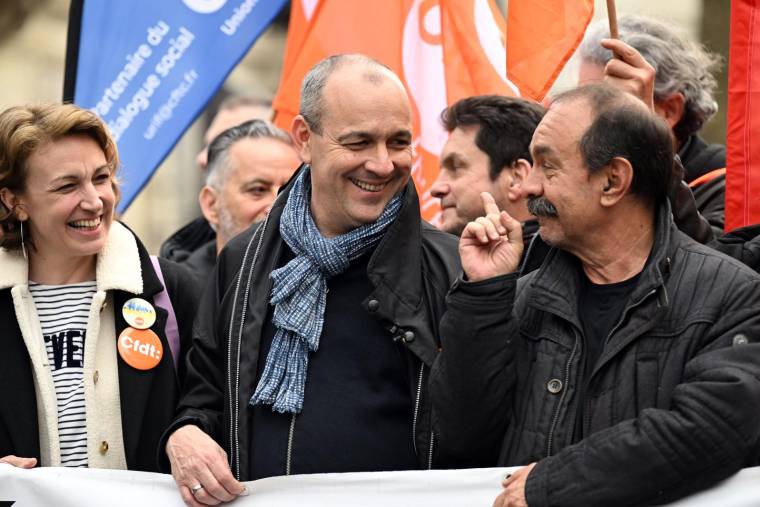 Laurent Berger et Philippe Martinez, le 22 mars 2023, à Paris ( AFP / Emmanuel DUNAND )