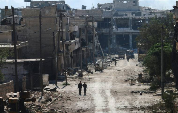 Des combattants pro-régime dans les faubourgs d'Alep, en Syrie, le 9 septembre 2016 ( AFP / GEORGE OURFALIAN )
