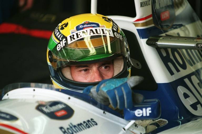 Ayrton Senna, dans le baquet de sa Williams-Renault à la veille de sa mort, le 30 avril 1994 à Imola ( AFP / JEAN-LOUP GAUTREAU )