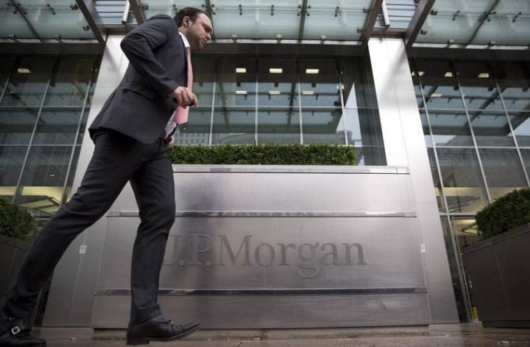 A pedestrian walks past the Canary Wharf offices of JP Morgan in London