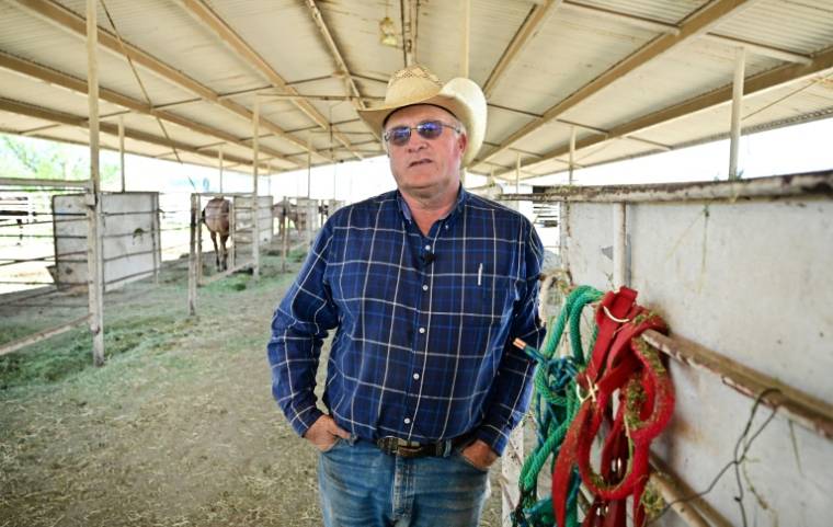 L'éleveur Kyle Best dans son ranch, le 16 avril 2024 à Amado, en Arizona ( AFP / Frederic J. BROWN )