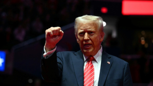 US President-elect Donald Trump reacts during a MAGA victory rally at Capital One Arena in Washington, DC, on January 19, 2025, one day ahead of his inauguration ceremony. ( AFP / Jim WATSON )