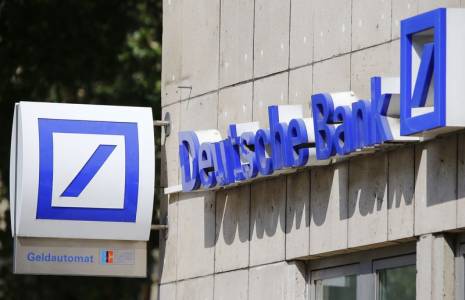 A logo of a branch of Germany's Deutsche Bank is seen in Cologne