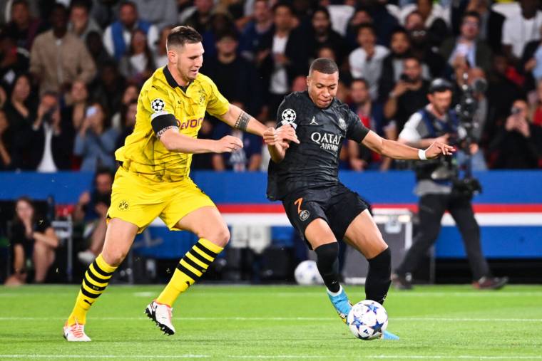 Kylian MBAPPE of PSG and Niklas SULE of Dortmund during the UEFA Champions League, match between Paris Saint-Germain and Borussia Dortmund at Parc des Princes on September 19, 2023 in Paris, France. (Photo by Anthony Dibon/Icon Sport)