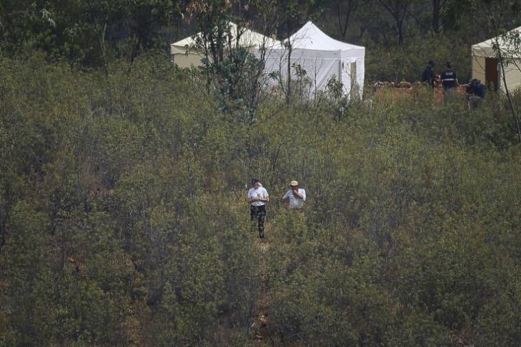 La police judiciaire portugaise mène des recherches dans la zone du barrage d'Arade à Silves dans le sud du Portugal, le 24 mai 2023 ( AFP / FILIPE AMORIM )