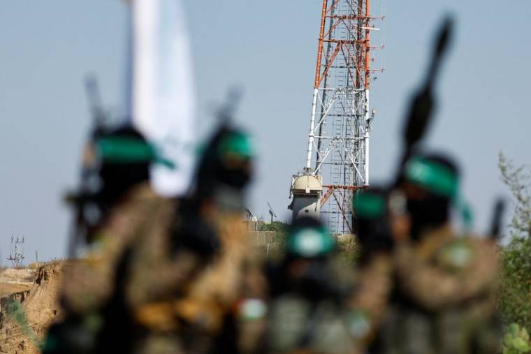 Des combattants palestiniens de la branche armée du Hamas lors d'un défilé militaire à Gaza