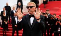 L'acteur-réalisateur américain Kevin Costner arrive pour la projection du film "Horizon: An American Saga", le 19 mai 2024 à Cannes  ( AFP / Valery HACHE )