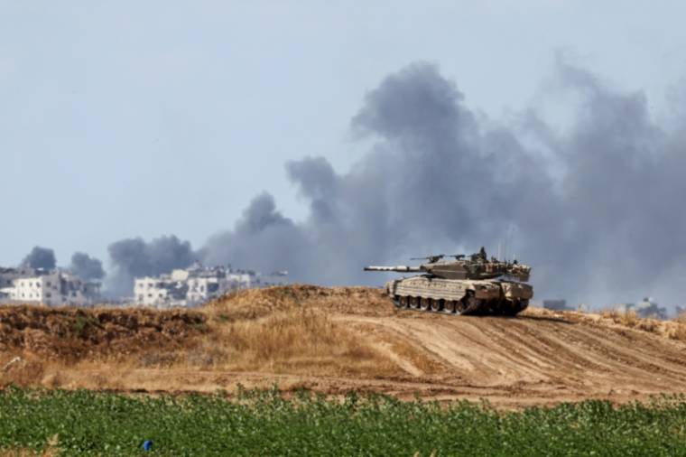 Un char israélien en position près de la frontière avec la bande de Gaza, le 13 mai 2024 ( AFP / JACK GUEZ )