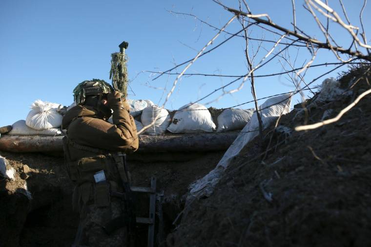 Des troupes sont massées des deux côtés de la frontière russo-ukrainienne, alors que le spectre d'une offensive hivernale plane ( AFP / Anatolii STEPANOV )