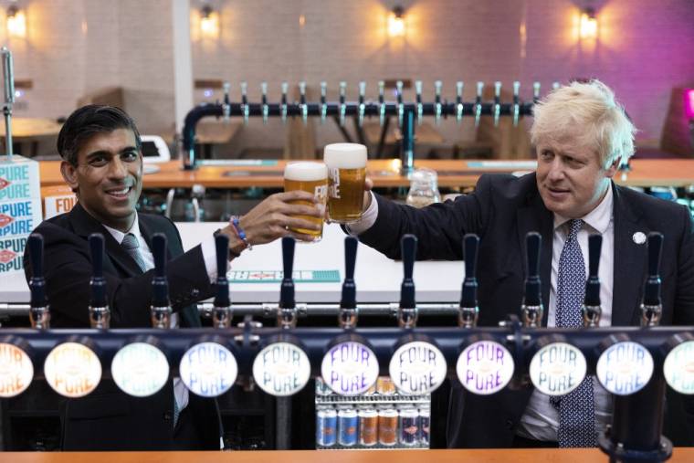 Boris Johnson et Rishi Sunak, à Londres, en 2021 ( POOL / DAN KITWOOD )