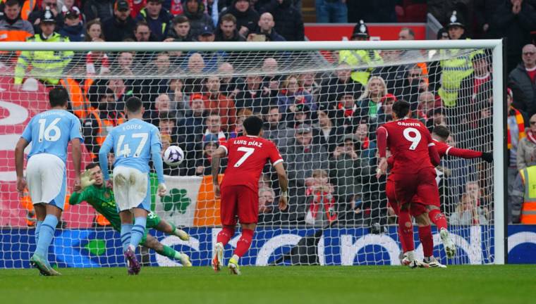 Liverpool's Alexis Mac Allister scores their first goal of the game from the penalty spot during the Premier League match at Anfield, Liverpool. Picture date: Sunday March 10, 2024.   - Photo by Icon Sport