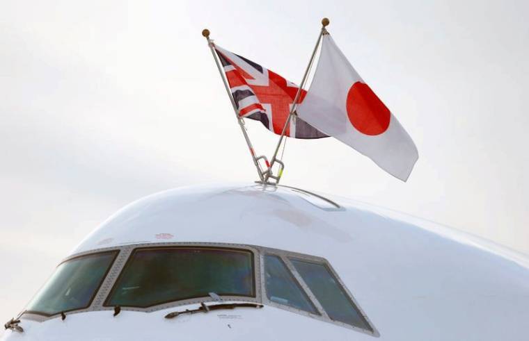 Flags of Japan and the United Kingdom are seen on the aircraft carrying Japan's Prime Minister Shinzo Abe as he arrives to attend the Enniskillen G8 summit, at Belfast International Airport