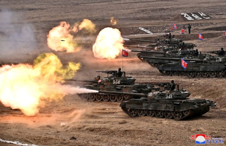 North Korean leader Kim Jong Un guides a military demonstration involving tank units